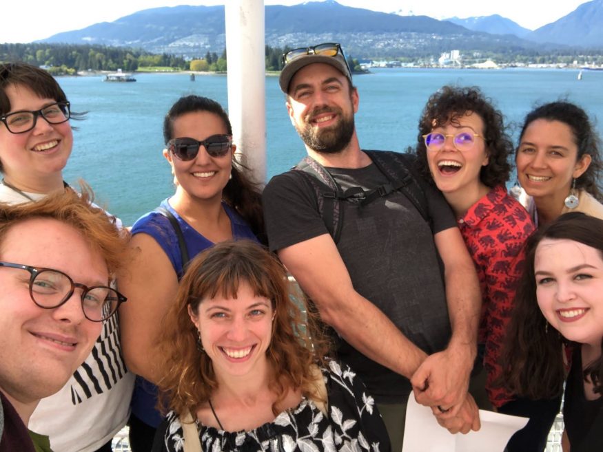 Goofy BC team selfie for eight, with ocean in the background.