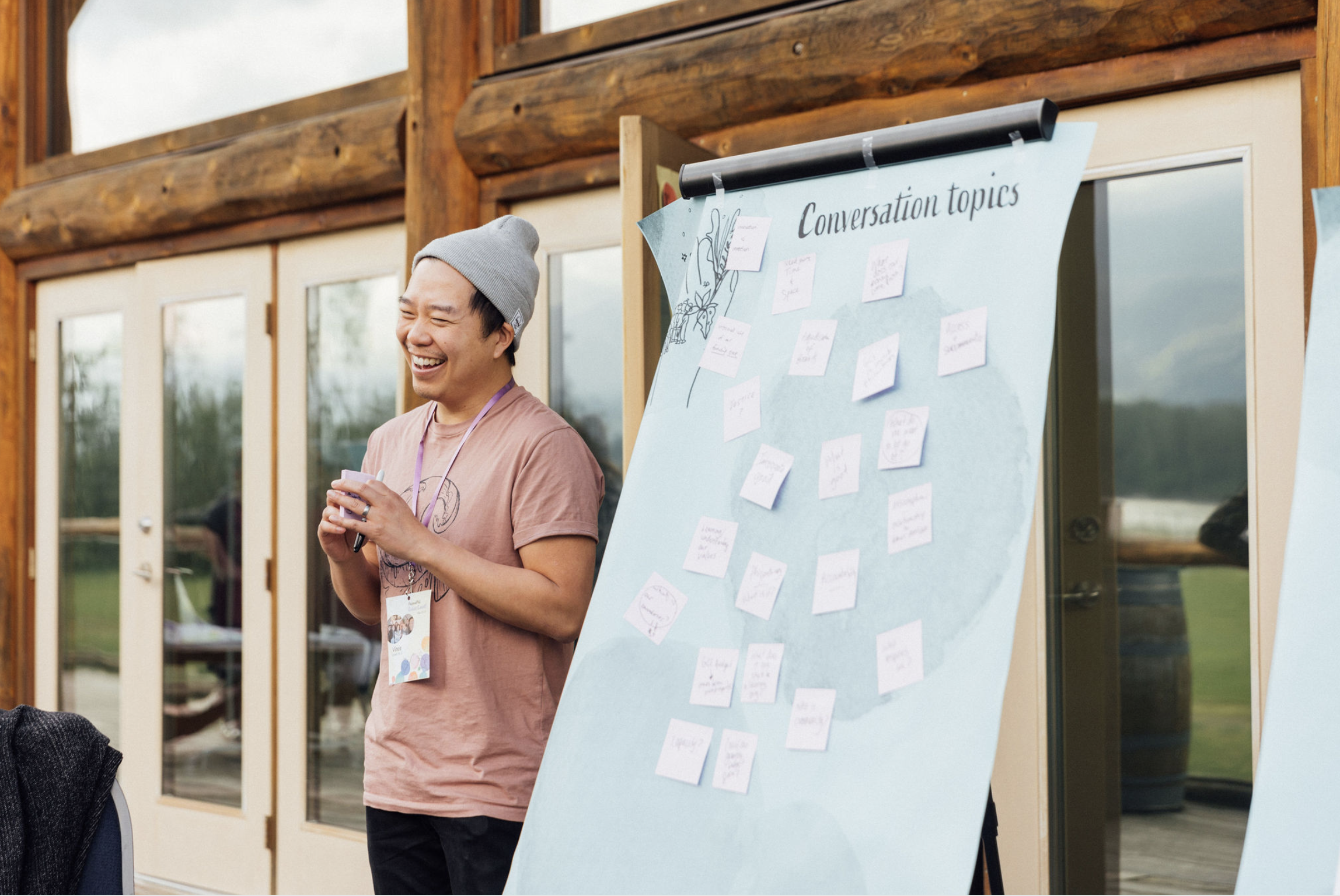 Man standing in front of easel smiling